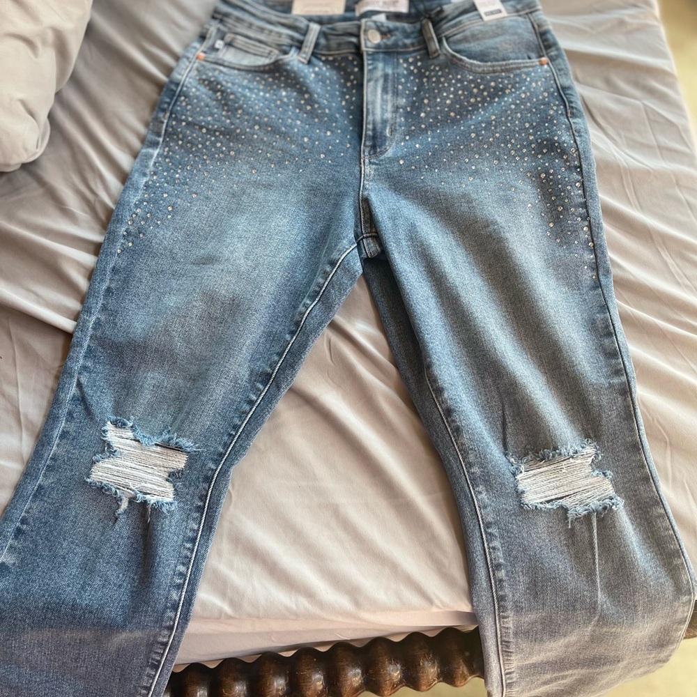 Judy Blue size 11 sparkles on sides and back pockets.